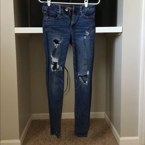 High waisted distressed jeans